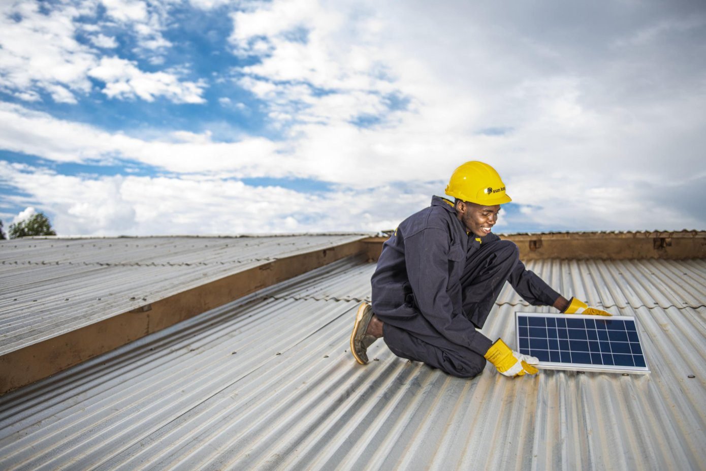 A man holding a solar panel